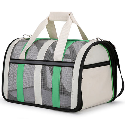 Sac de transport pour chien Le Rétro de couleur turquoise et crème avec parois en maille grise, poignées de transport confortables et design moderne style sac de sport.