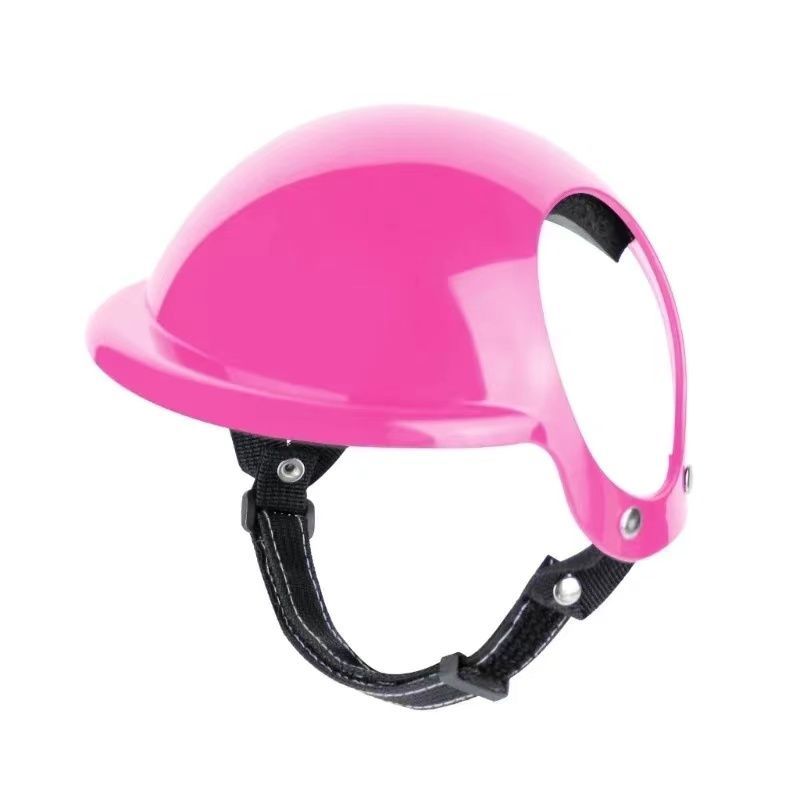 Vue de profil d'un casque de moto rose pour chien avec coque rigide brillante, mousse de protection intérieure et double sangle de sécurité ajustable.