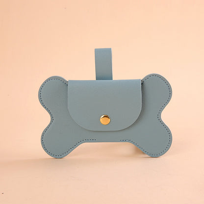 Distributeur de sacs à crottes design en simili-cuir pour laisse, pochette élégante en forme d'os avec fermeture à pression, accessoire d'hygiène canine, boutique Pitou et moi.