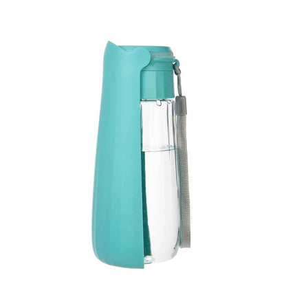 Gourde pour chien portable et pliable Hydra de couleur turquoise avec dragonne grise, isolée sur un fond blanc.