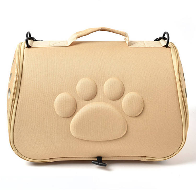 Sac de transport beige pour chien et chat Toutou Express avec motif patte en relief et bandoulière.