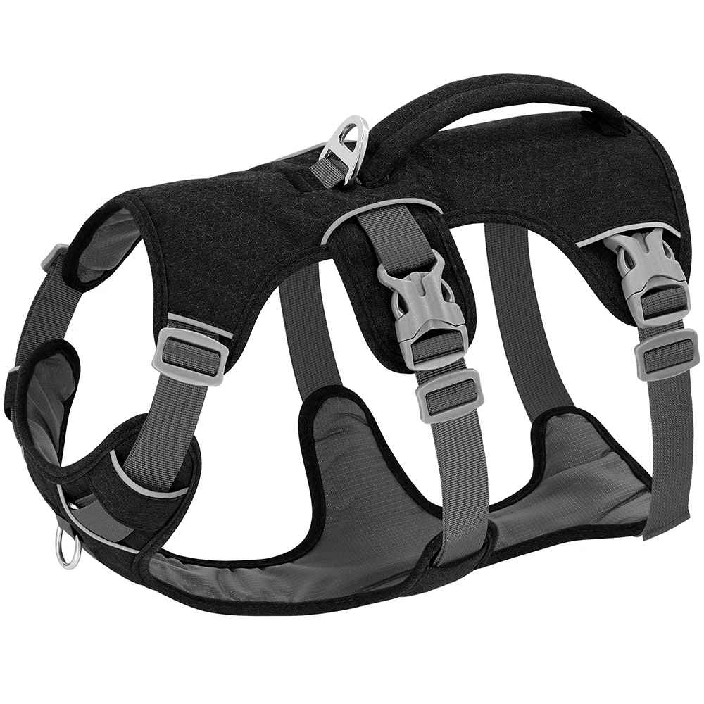 Vue de profil du harnais pour chien UniDog en nylon noir robuste, mettant en évidence la poignée dorsale de contrôle, l'anneau d'attache en métal et les bordures réfléchissantes pour la sécurité.